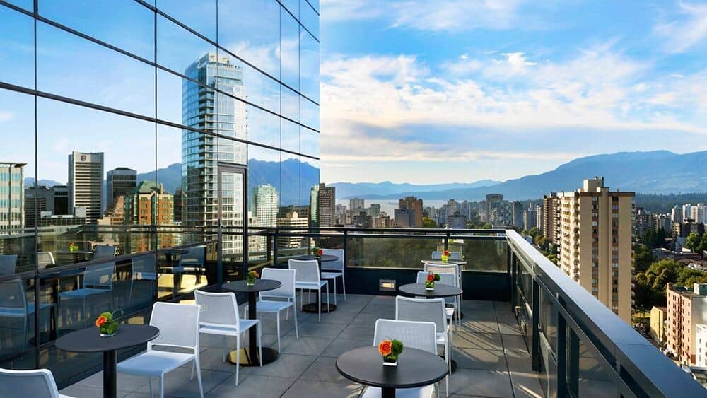 Shared rooftop terrace with cafe seating and North Shore mountain views