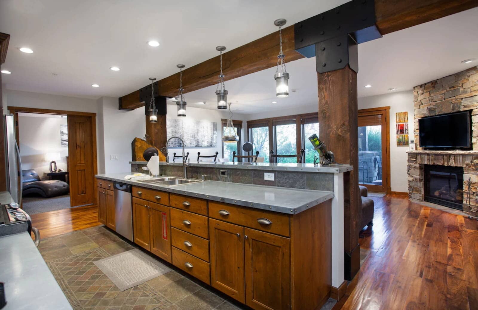 Kitchen island with zinc countertops and breakfast bar seating for 4