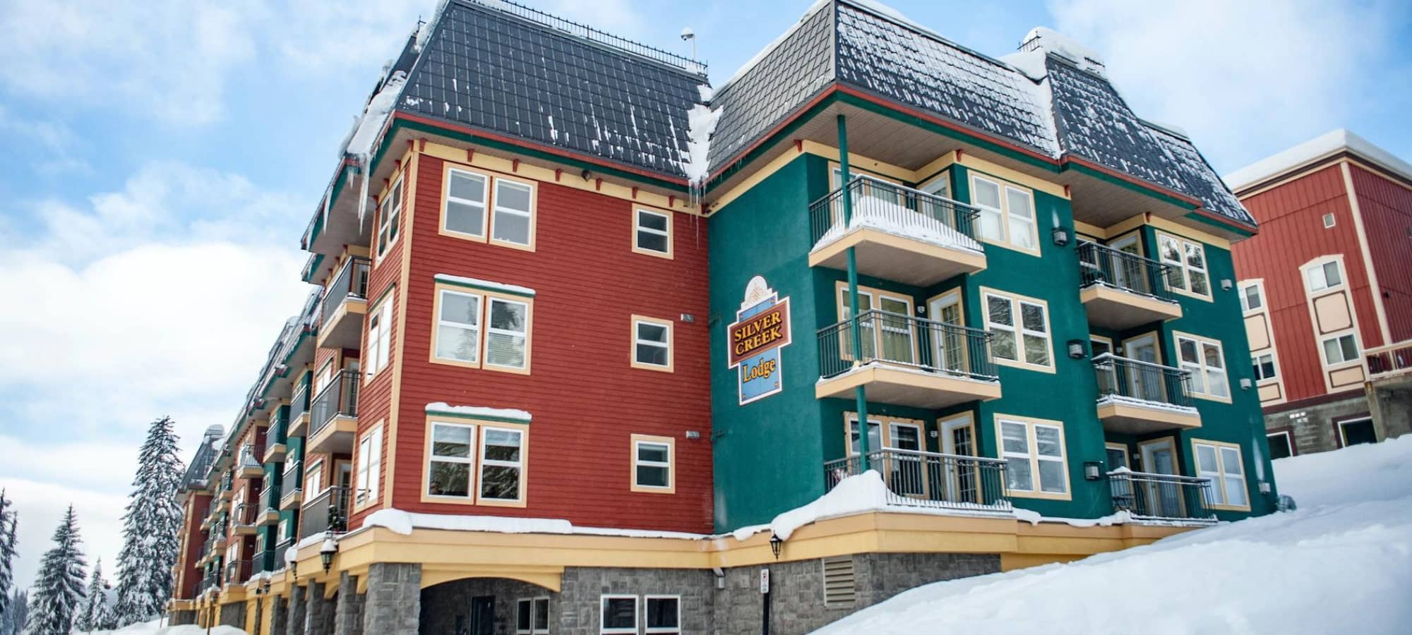 Silver Creek Lodge exterior with private balconies and snow-covered landscape