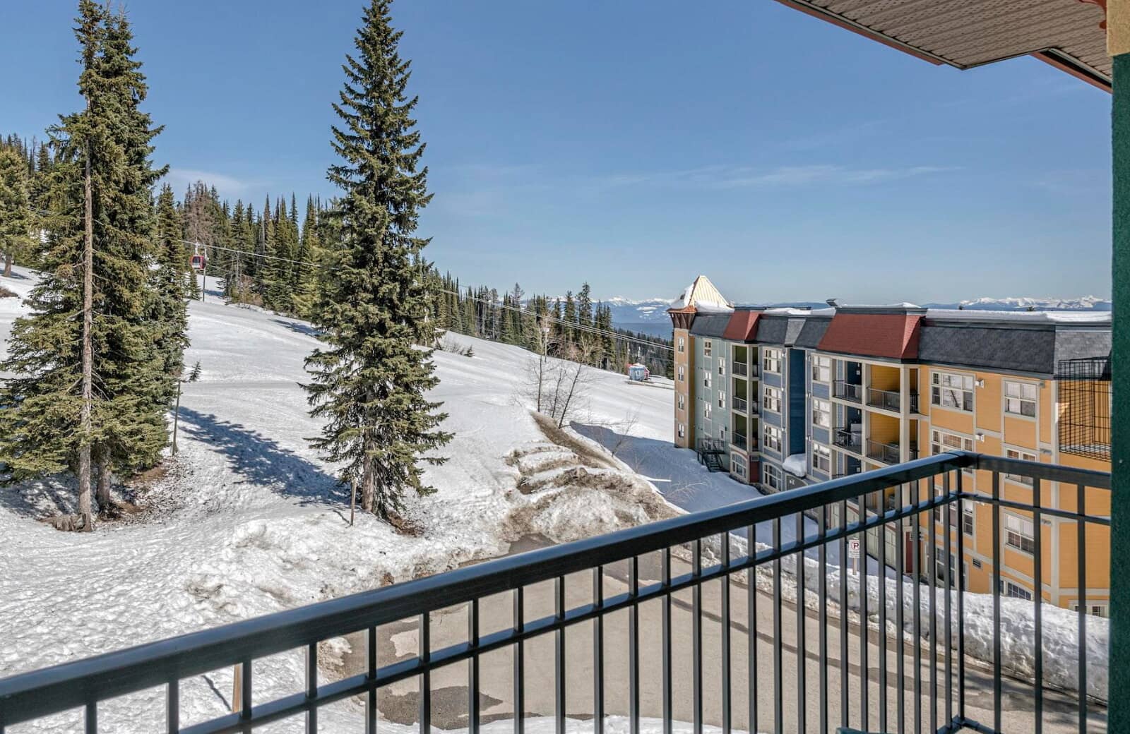 Balcony with views of ski slopes and resort gondola