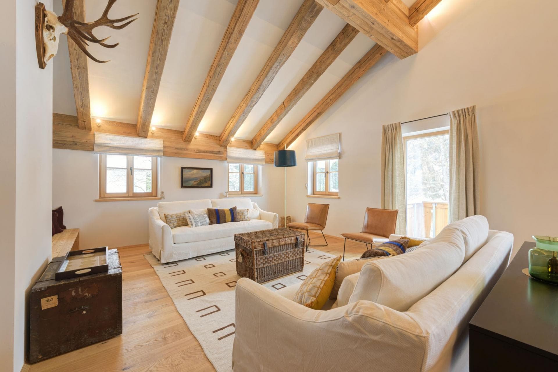 Living area with vaulted timber ceilings and seating for six