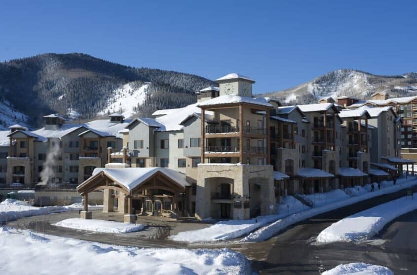 Ski-in, ski-out resort exterior with porte-cochère and mountain views