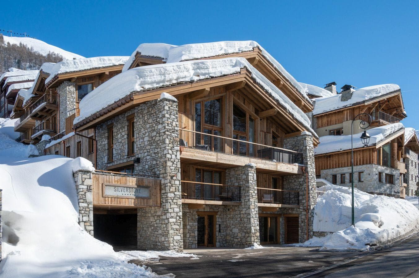 Ski-in lodge exterior with underground parking and private balconies