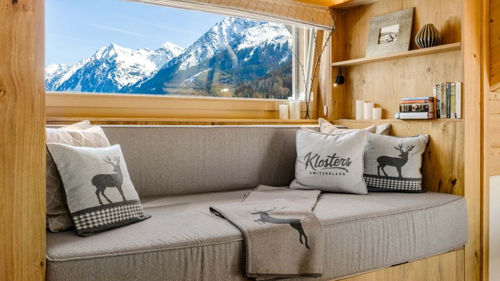 Window daybed with mountain views and built-in shelving