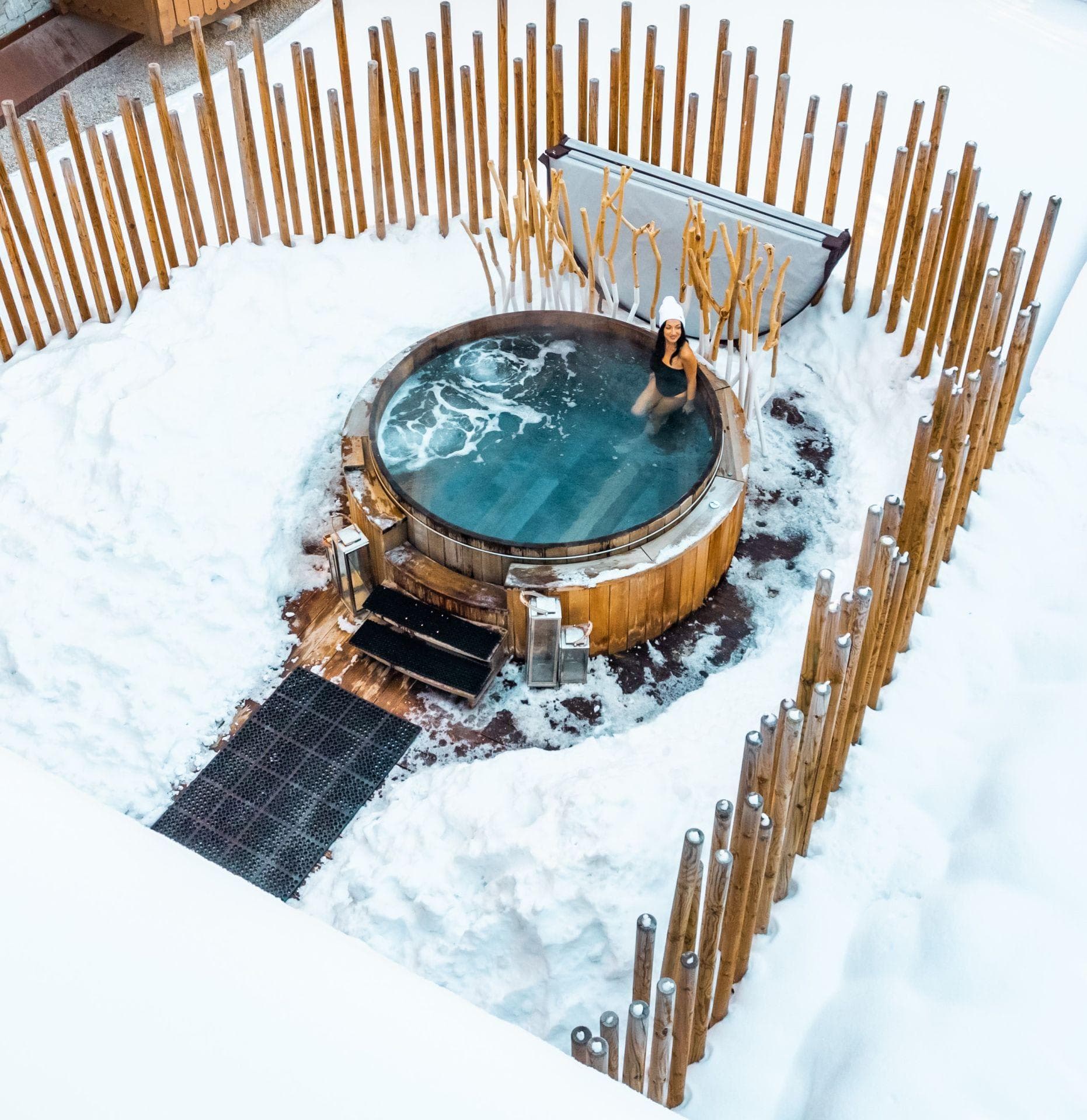 Cedar hot tub with privacy fencing and integrated bench seating