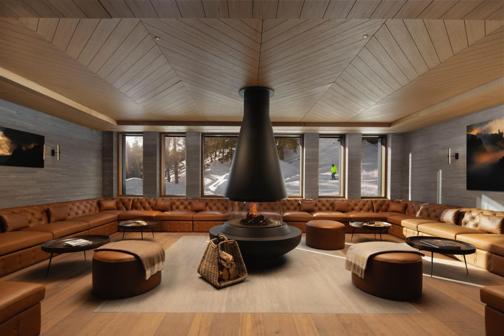Lounge with central wood-burning fireplace and wrap-around seating for 20