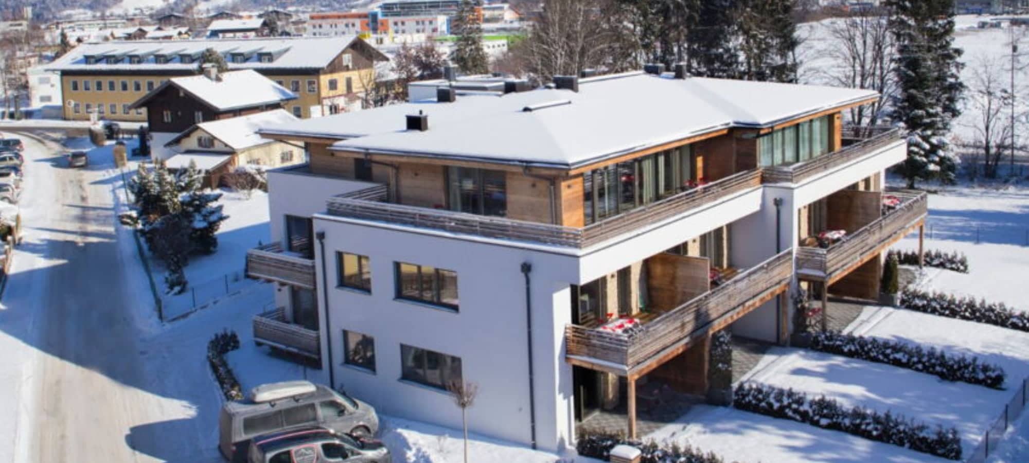 Chalet exterior with private balconies and designated guest parking