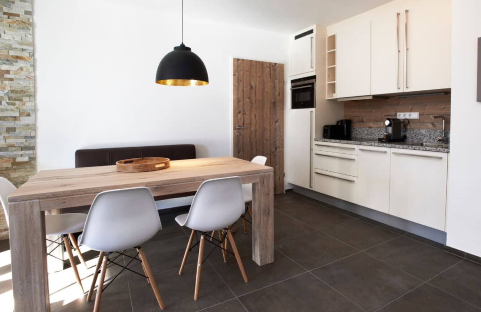 Dining area seats 6; kitchen with integrated microwave and espresso machine