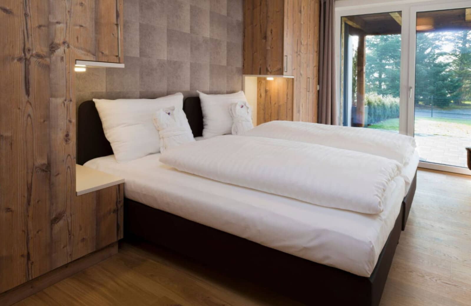 Bedroom with terrace access and built-in reading lights