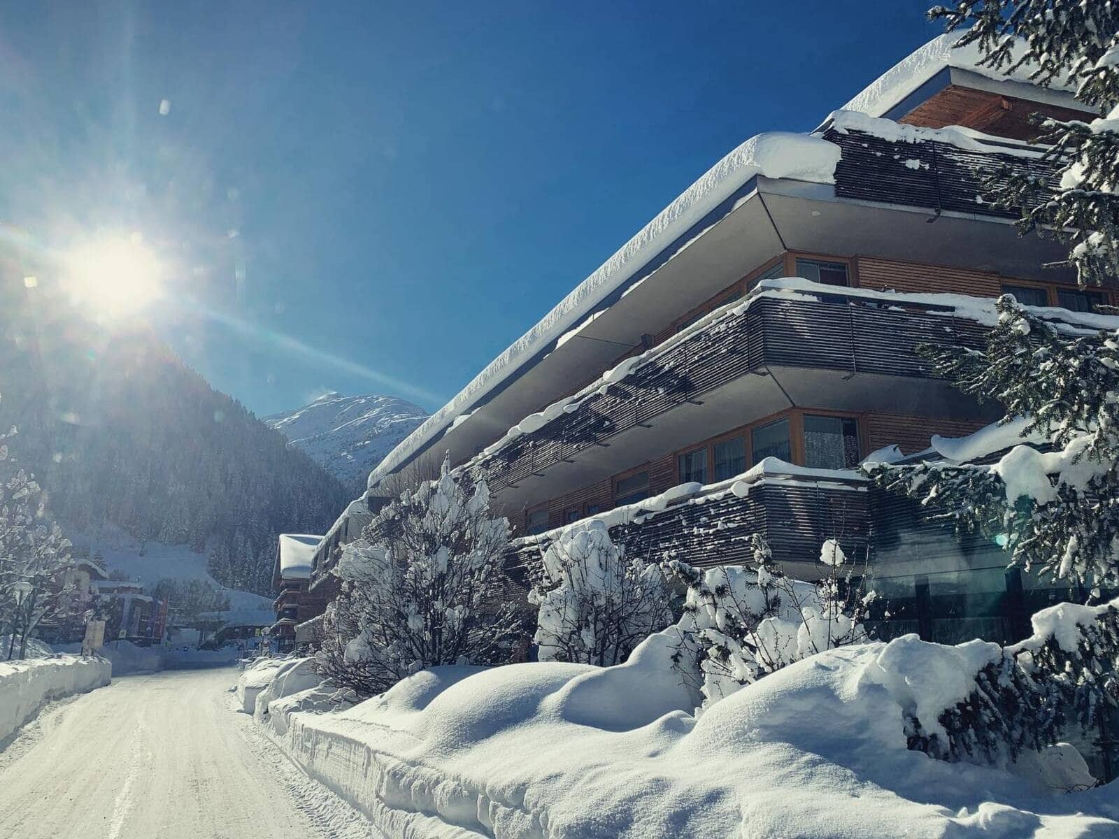 Chalet exterior with private balconies and south-facing mountain views