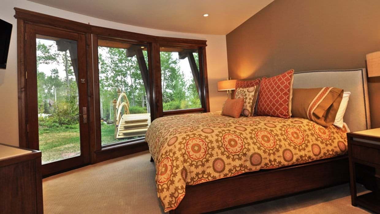 Primary bedroom with king bed and private terrace access