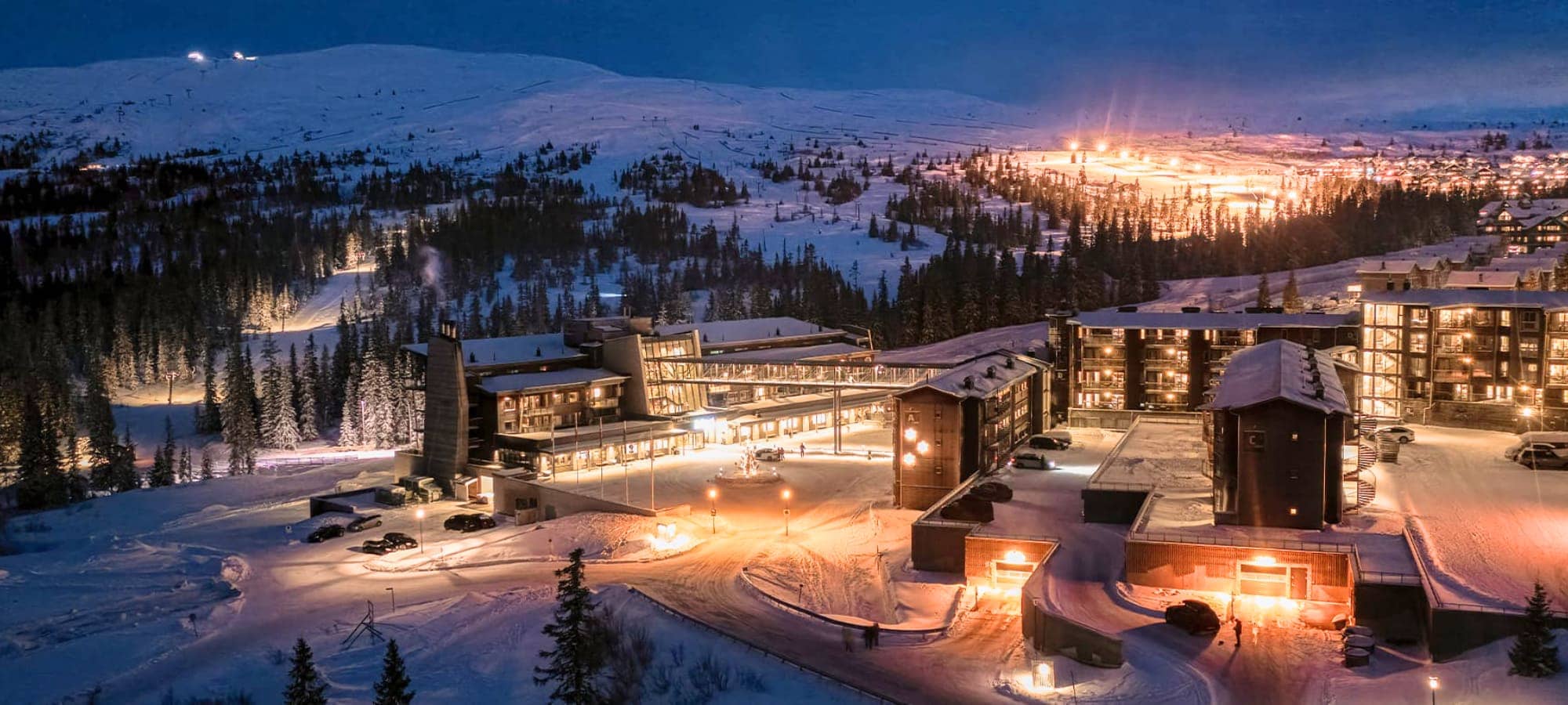 Ski-in/ski-out resort exterior with direct access to floodlit night trails