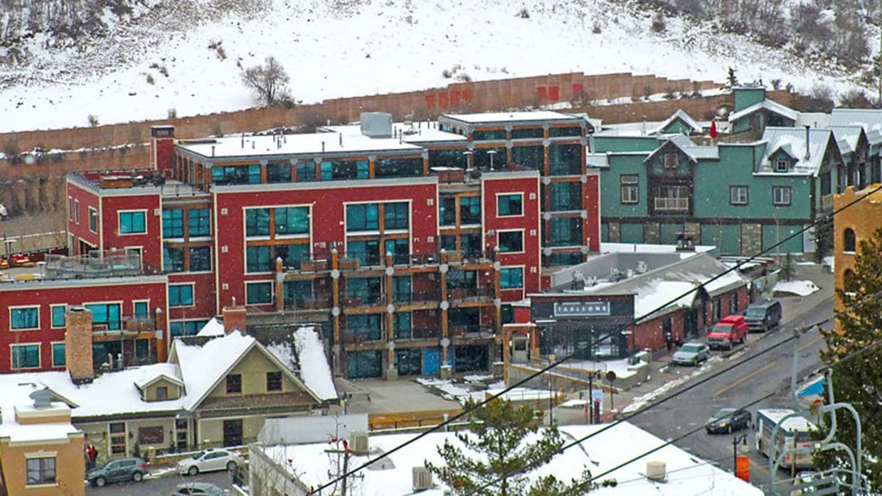 Building exterior showing unit proximity to town transit and ski lifts