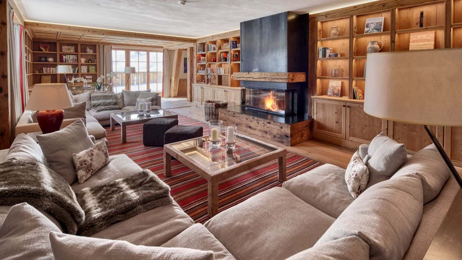 Living area with wood-burning fireplace and sectional seating for 10