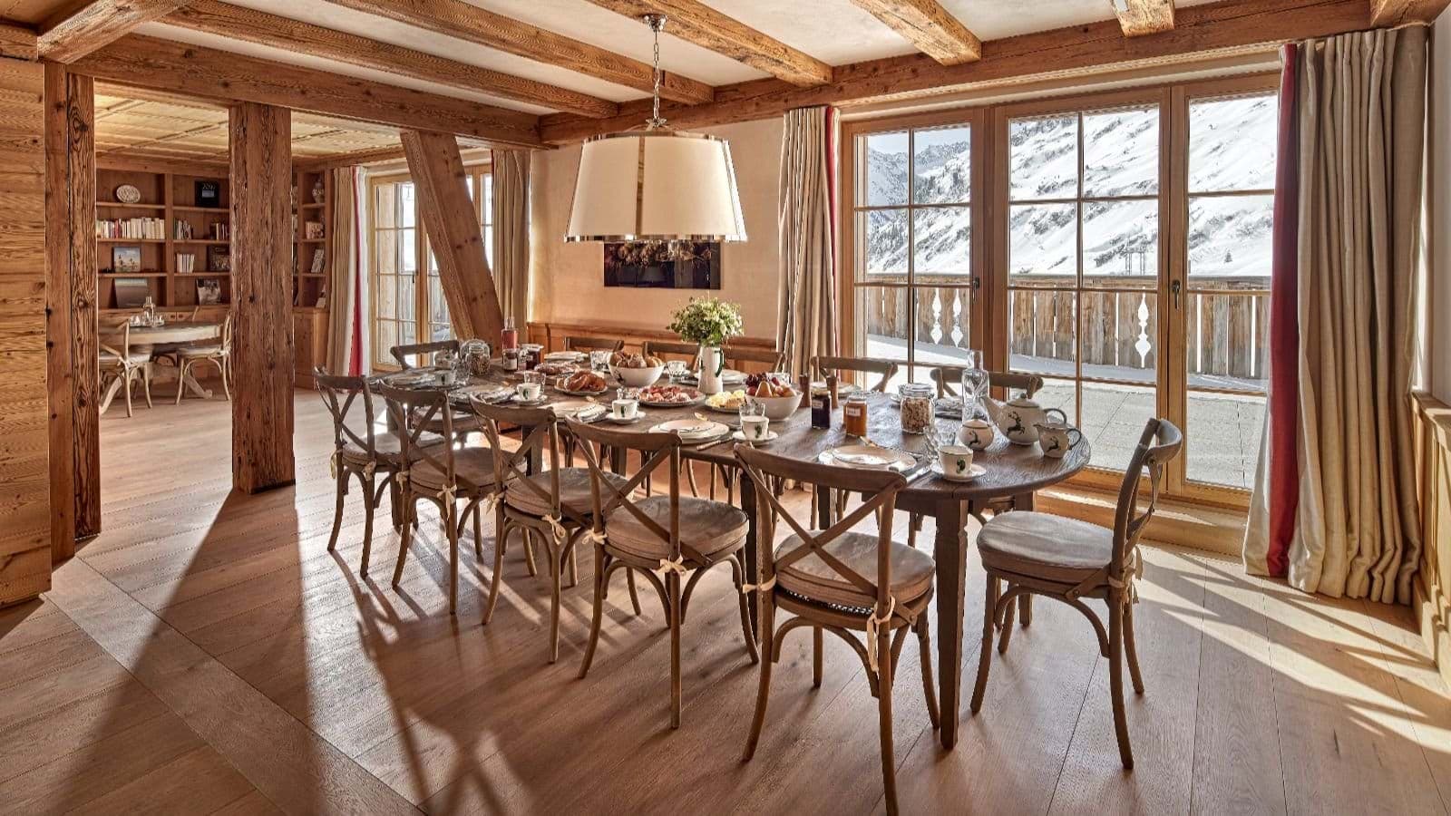 Dining table with seating for 10 and snowy mountain views