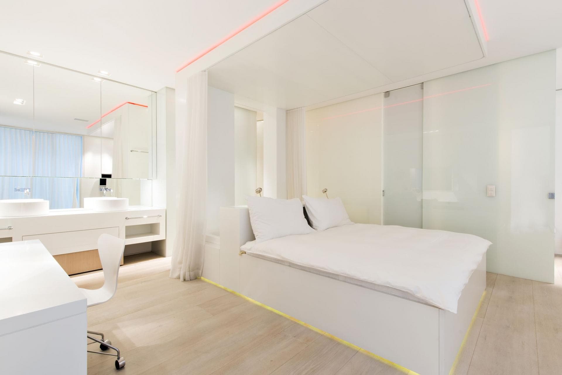 Primary suite with king bed and open-concept dual vanity