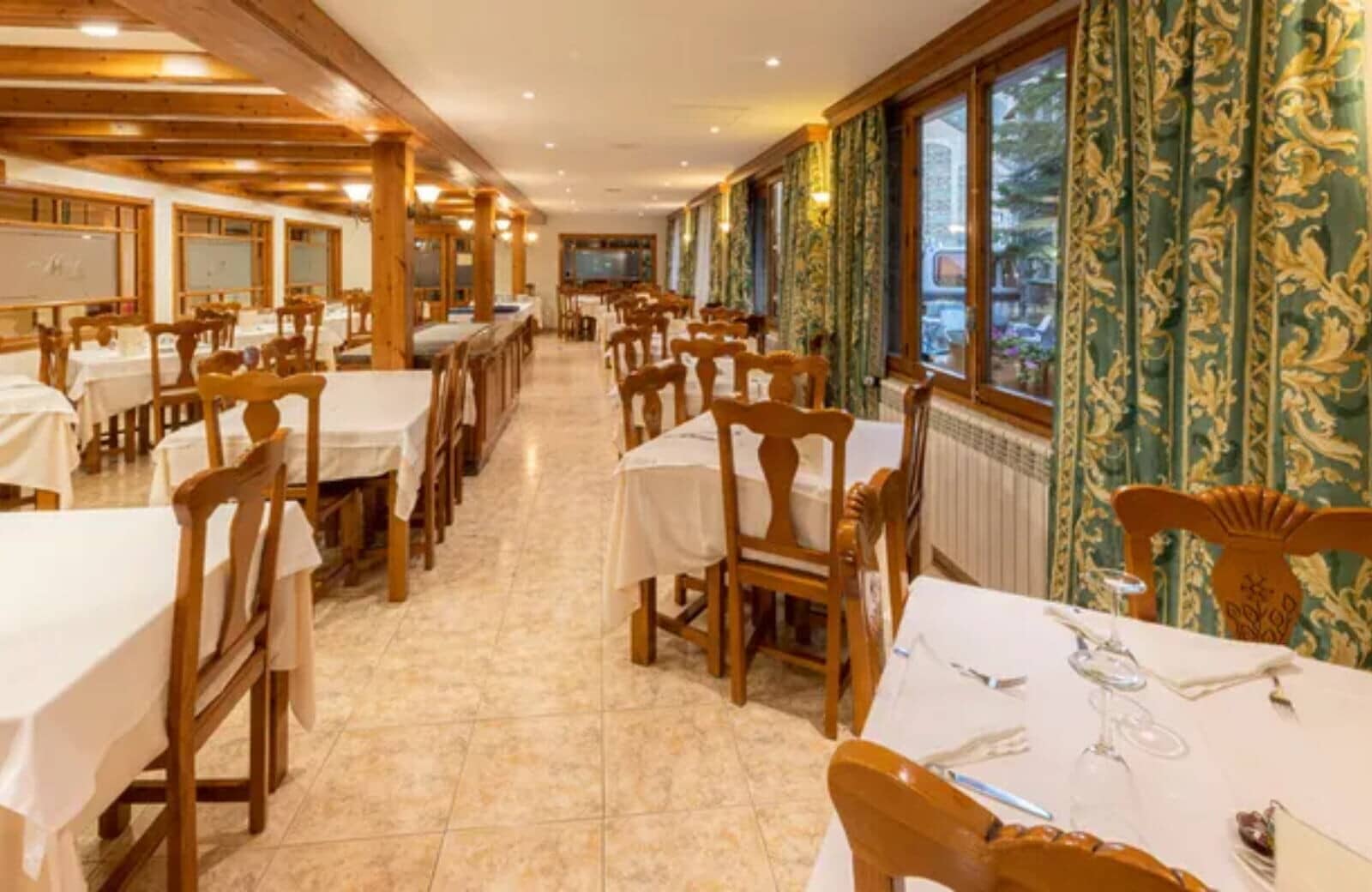 Dining hall with seating for 40+ and exposed timber beams