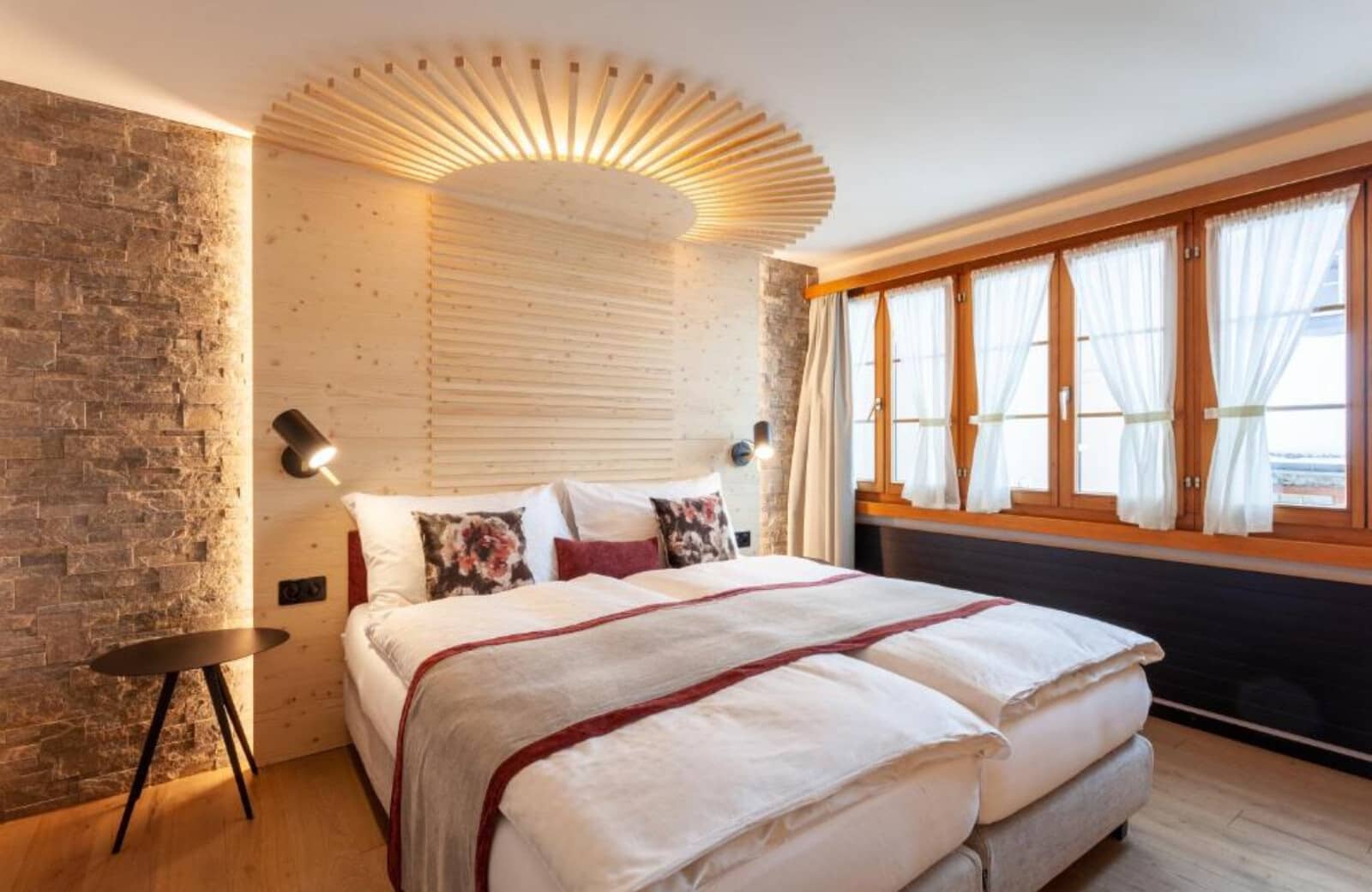 Bedroom with two twin beds joined as king and integrated reading lights
