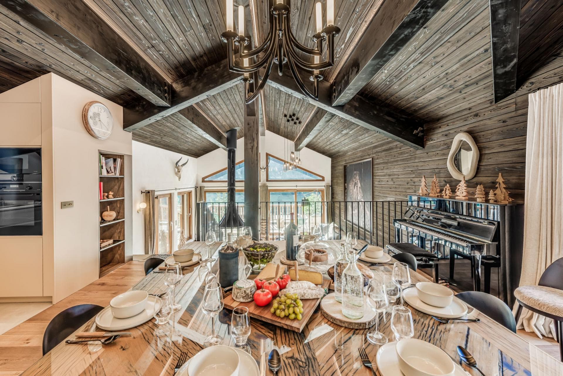 Dining area seats 8 with mountain views and upright piano