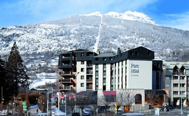 Hotel exterior with private balconies and direct mountain slope views