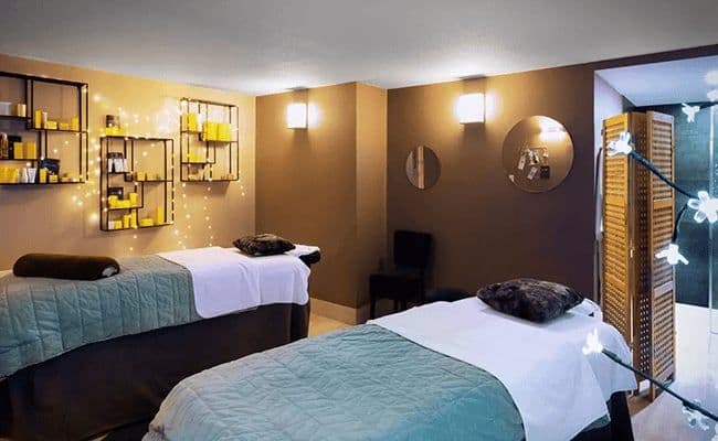 On-site spa treatment room with two massage tables