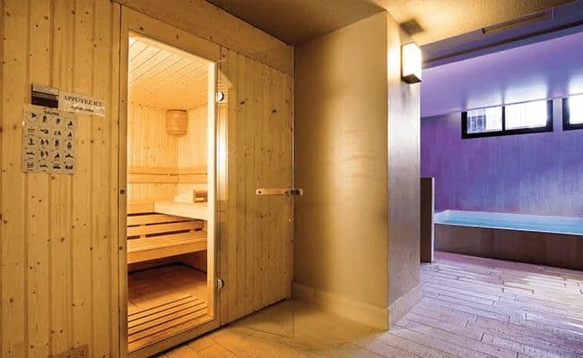 Private spa area with wood-lined sauna and indoor plunge pool