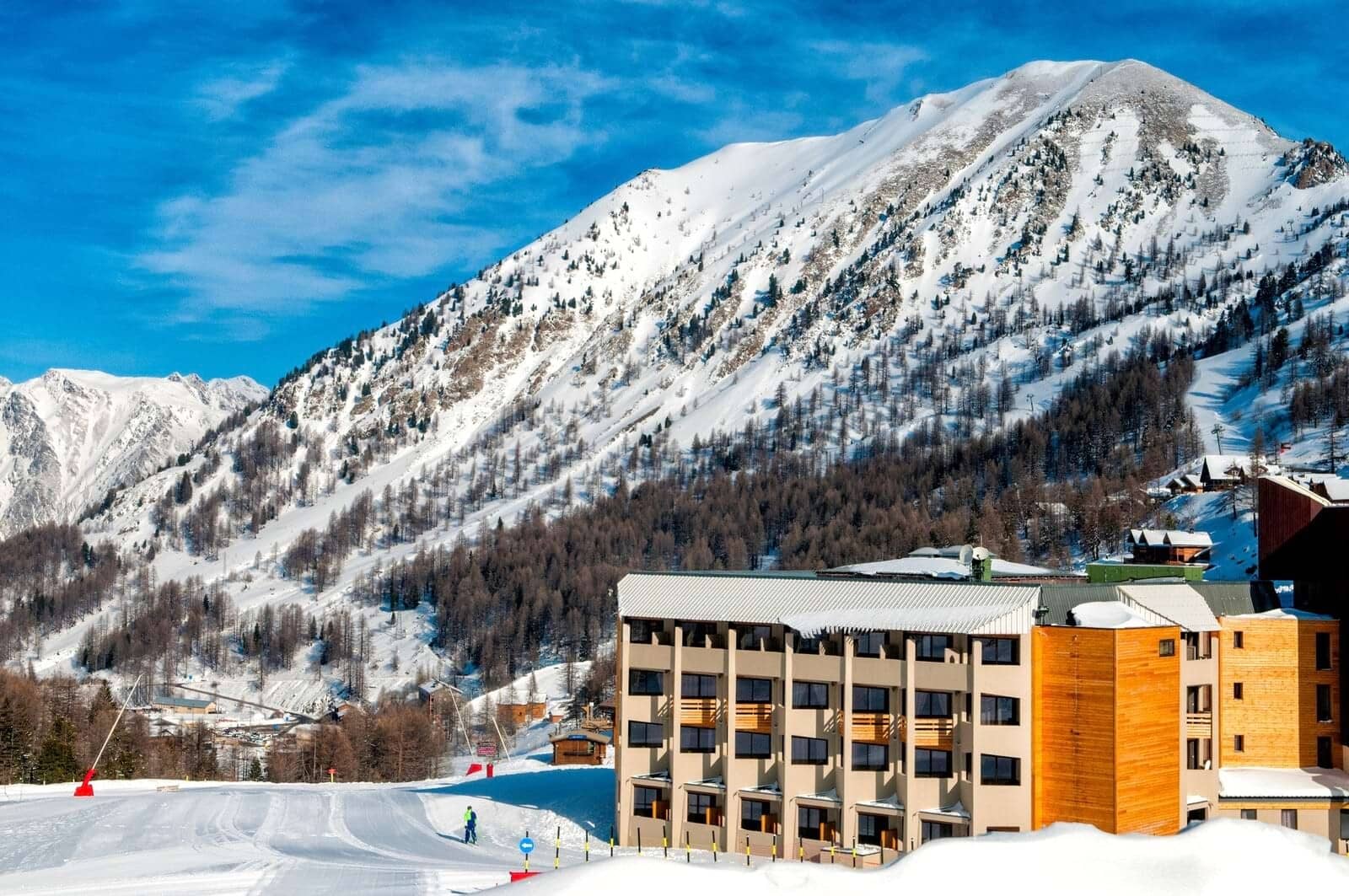 Ski-in/ski-out resort exterior with direct access to groomed mountain runs