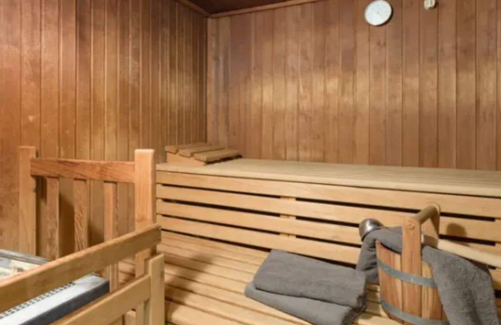 Private cedar sauna with tiered seating and included towels