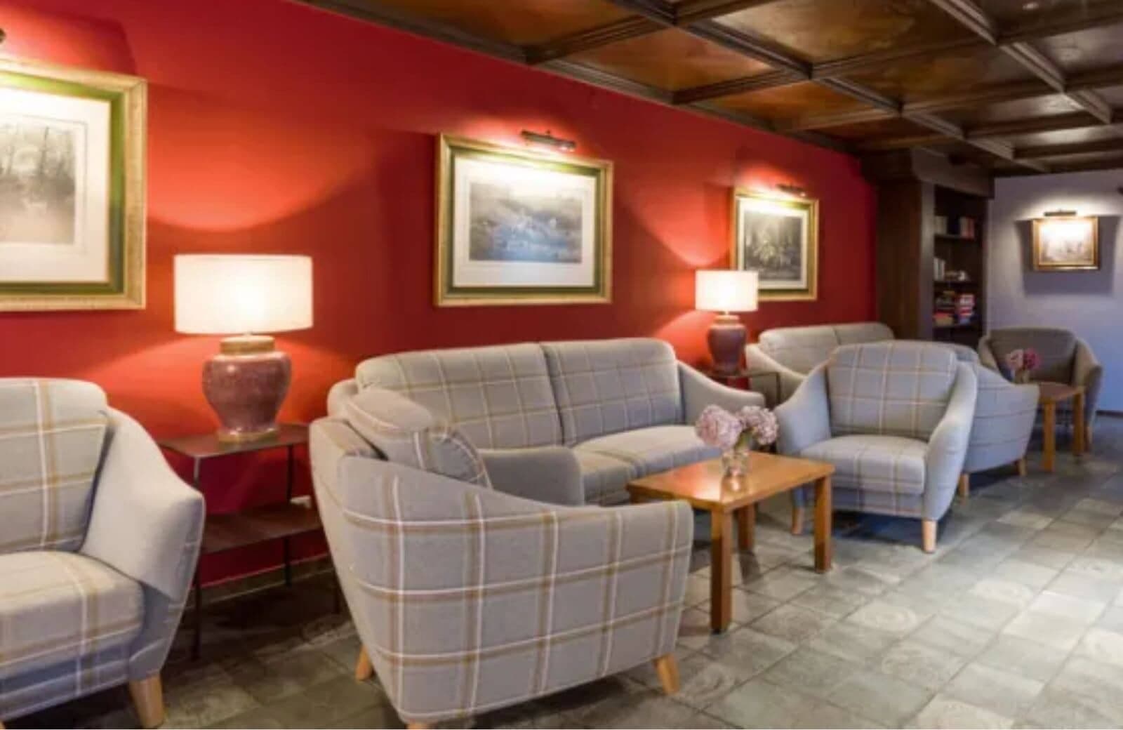Lounge area with coffered wood ceiling and seating for 8