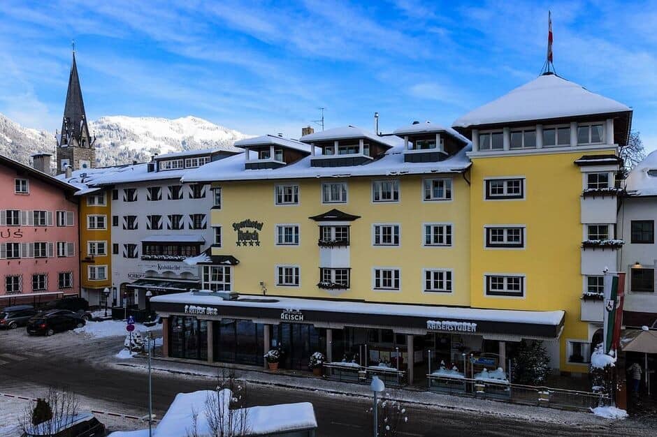 Hotel exterior with mountain views and street-level restaurant