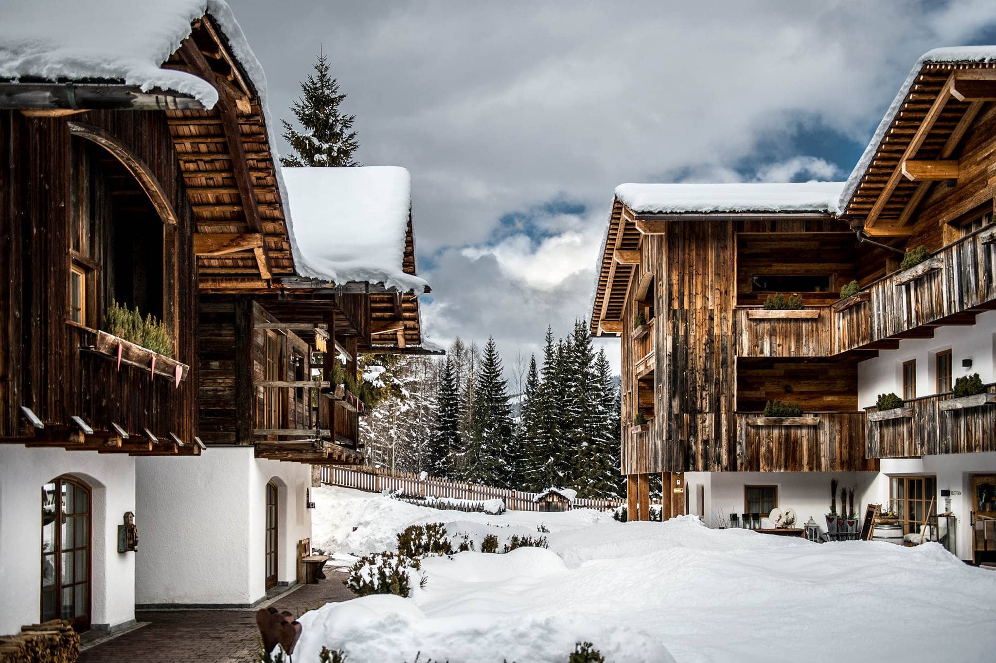 Ski-in access; chalet exterior with private balconies and mountain views