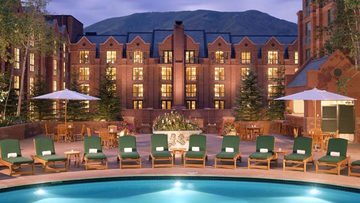 Shared pool deck with poolside bar and mountain views