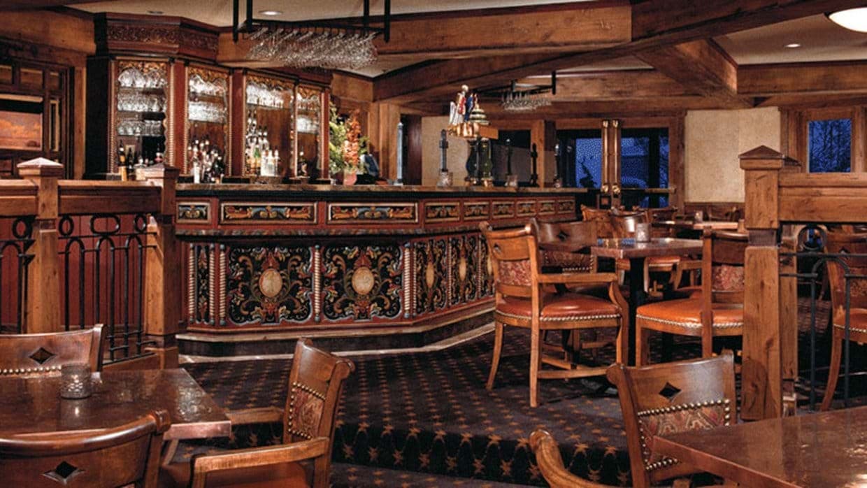 Lodge bar with hand-painted woodwork and local craft beer taps