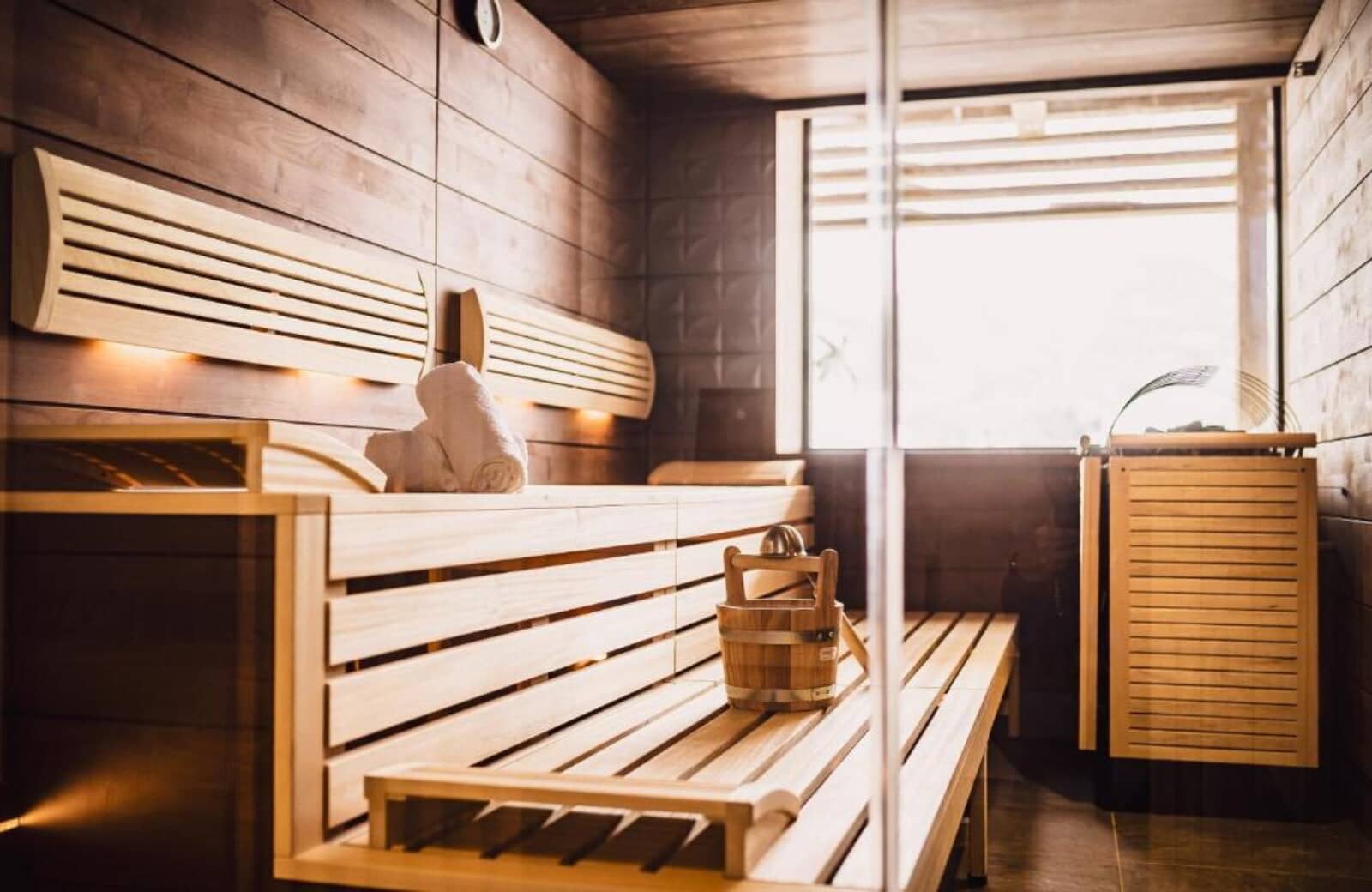 Private cedar sauna with tiered seating and exterior window