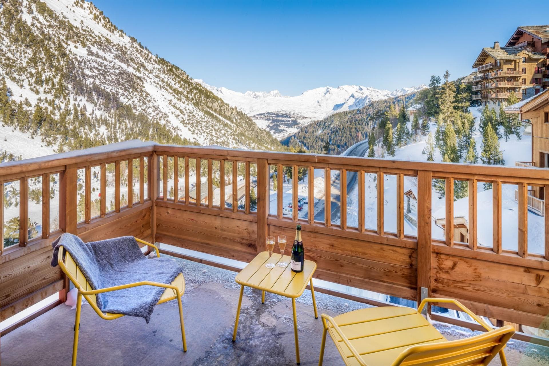 Private balcony with seating and panoramic valley views