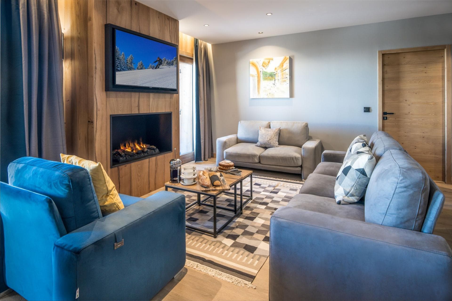 Living area with electric fireplace and smart TV; seating for 6