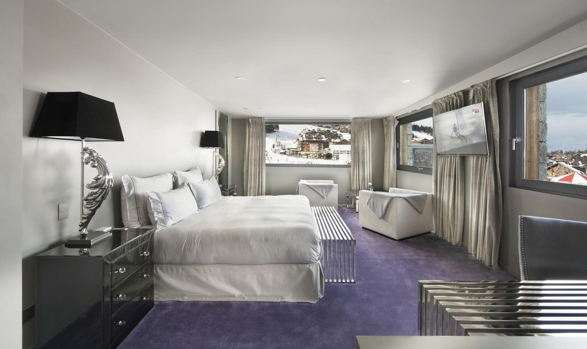 Primary bedroom with king bed and ski-in/ski-out resort views