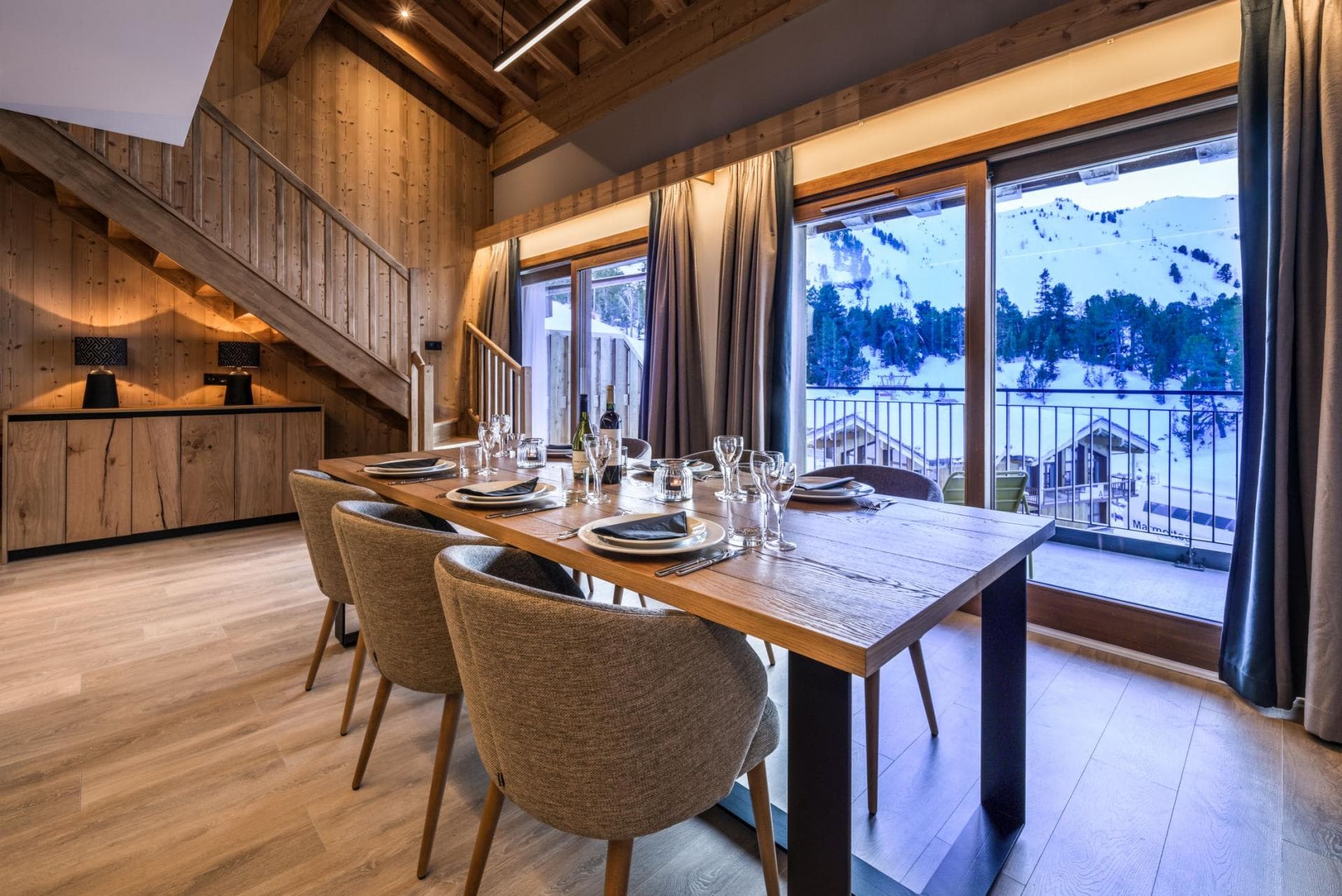 Dining area seats 8 with balcony and mountain views