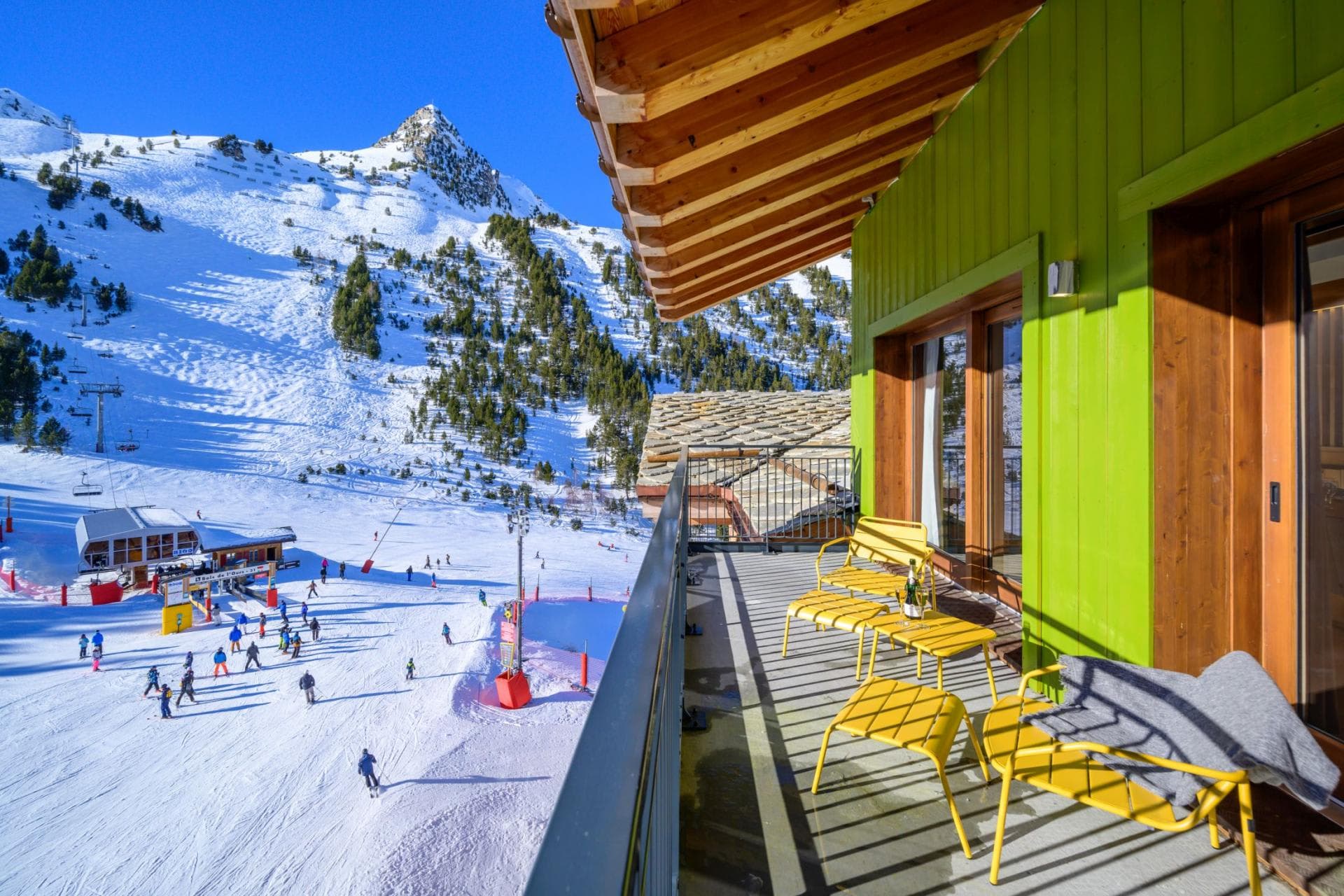 Private balcony overlooking ski lift and mountain slopes