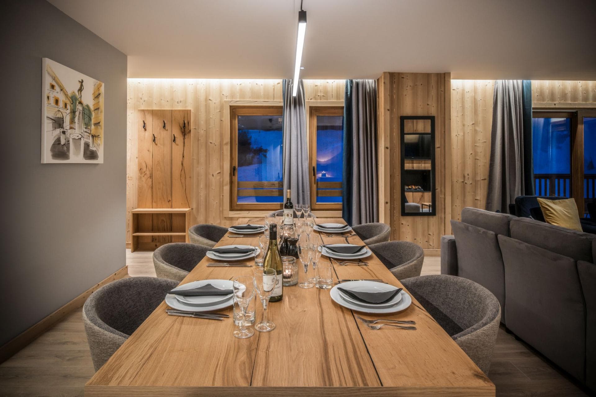 Dining area with seating for 8 and adjacent gear storage hooks