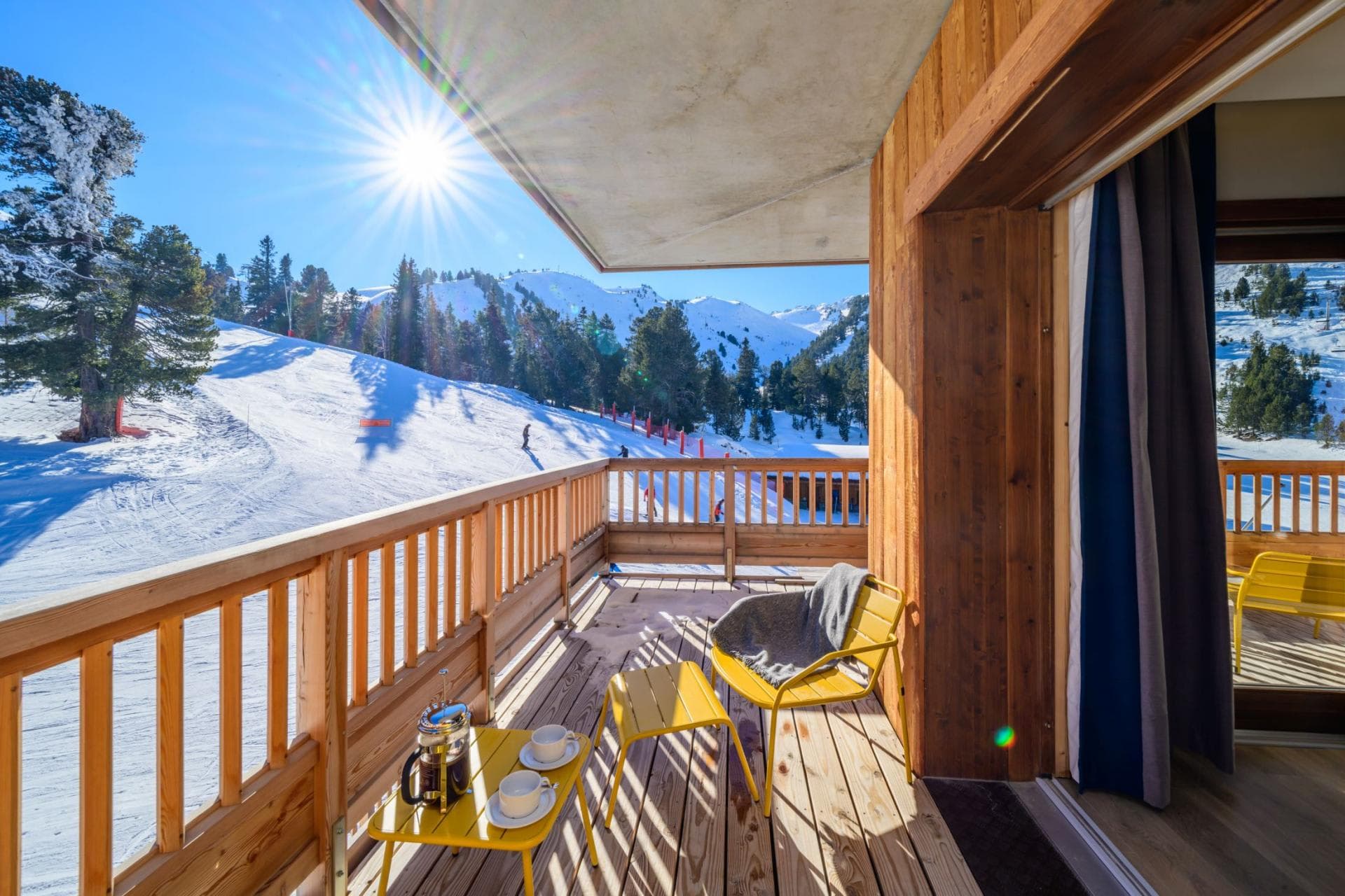 Private balcony with seating and direct ski-in/ski-out piste views