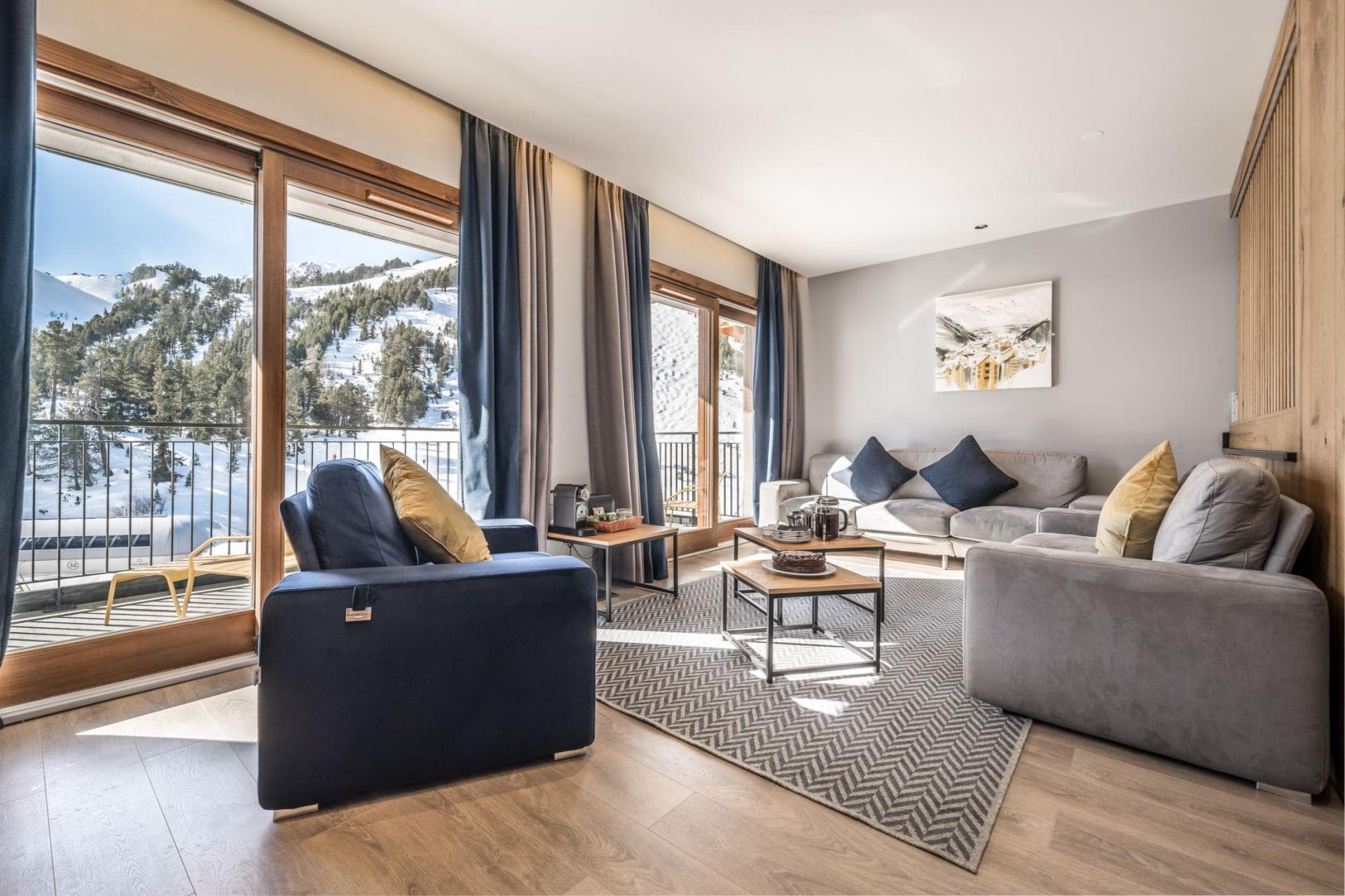 Living area with floor-to-ceiling windows and private balcony access