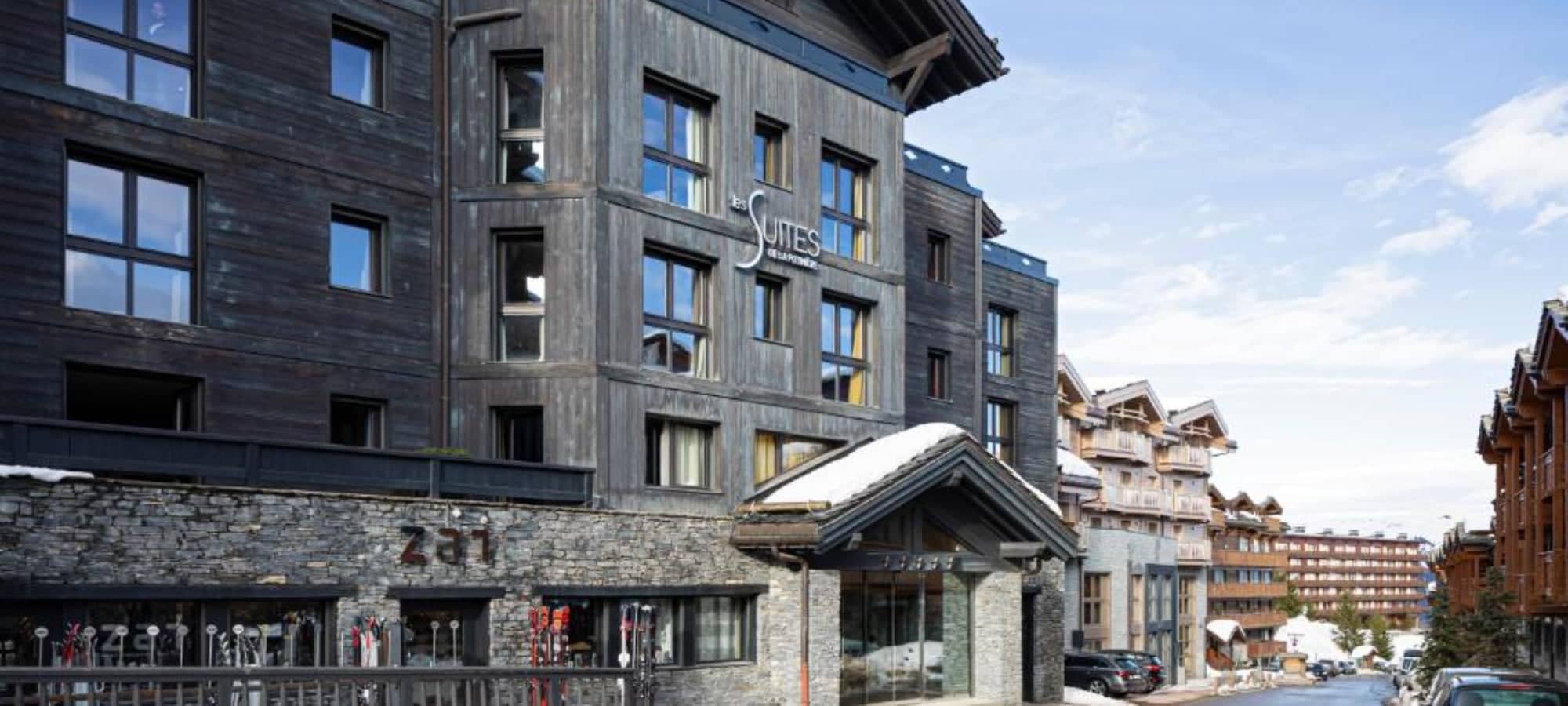 Chalet exterior featuring on-site Zai ski shop and street-level entrance