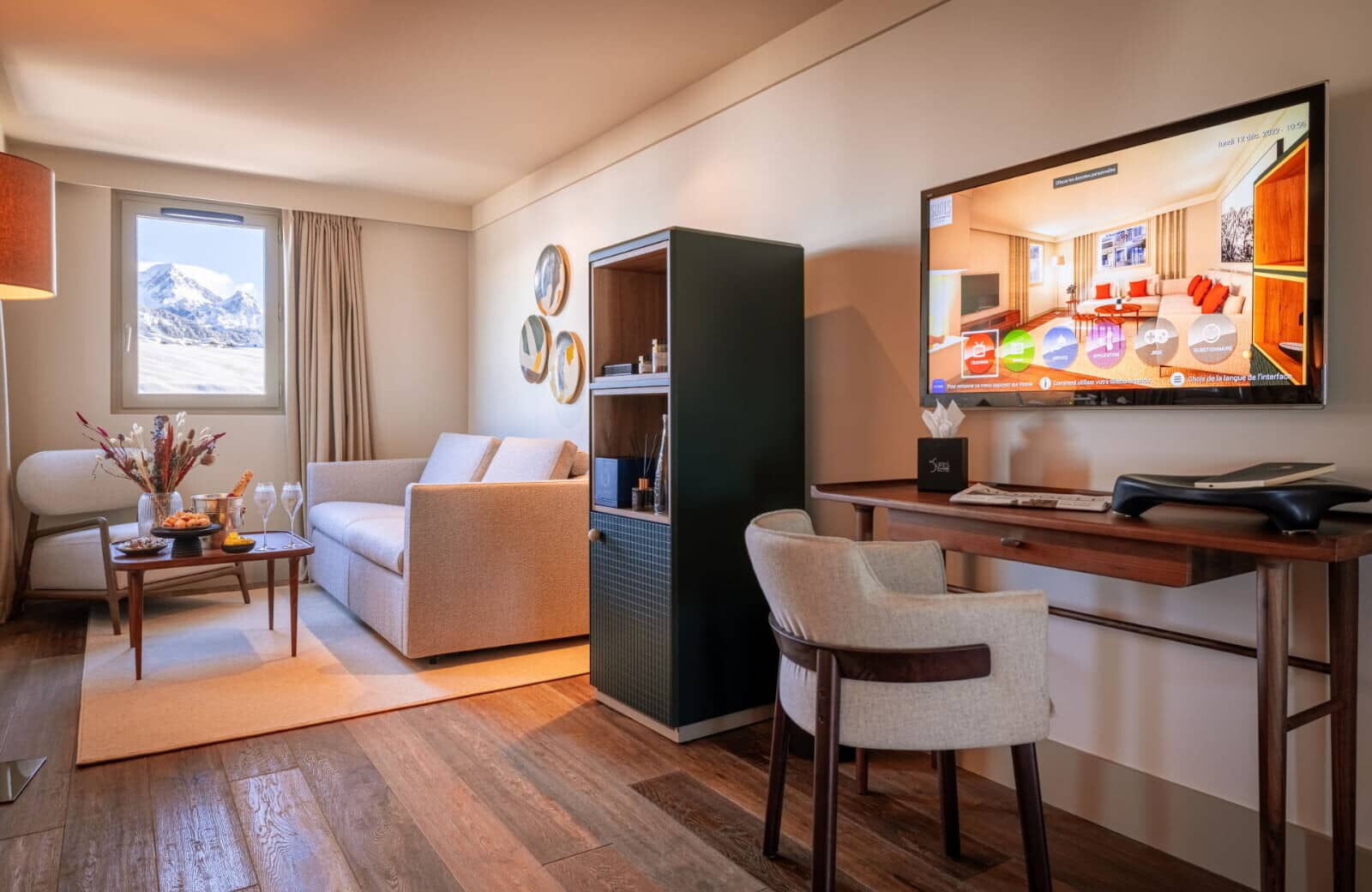 Living area with sleeper sofa, work desk, and mountain views