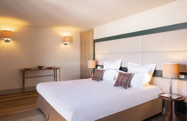 Bedroom with king bed and built-in oak closet storage