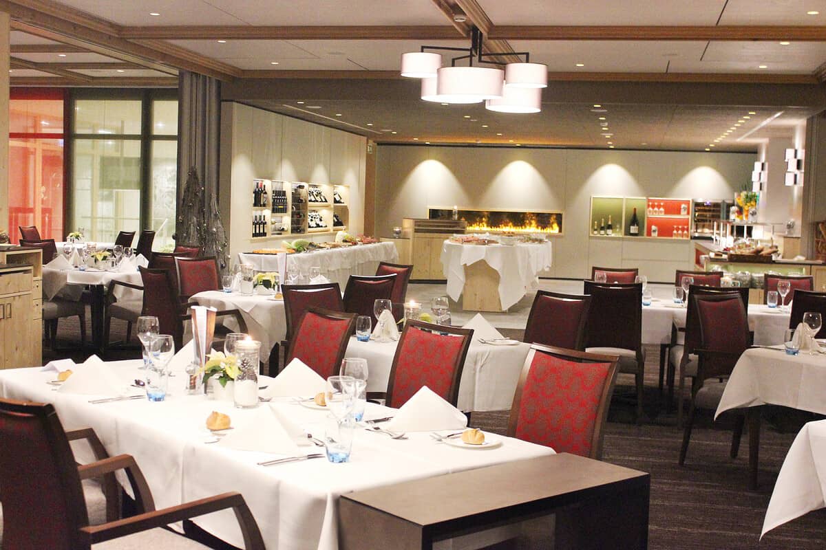 Shared dining room featuring buffet stations and linear fireplace