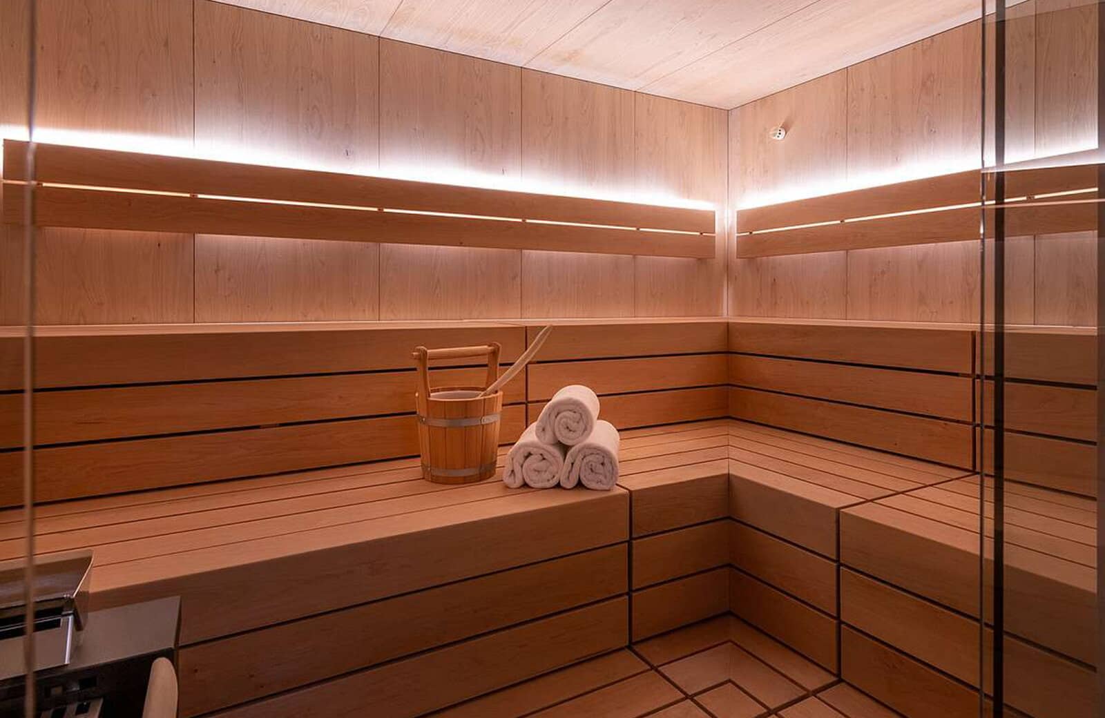 Private cedar sauna with tiered seating and LED accent lighting