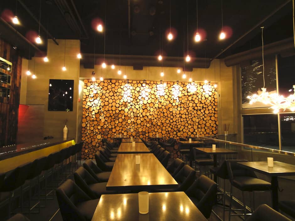 Dining area with log accent wall and seating for 40