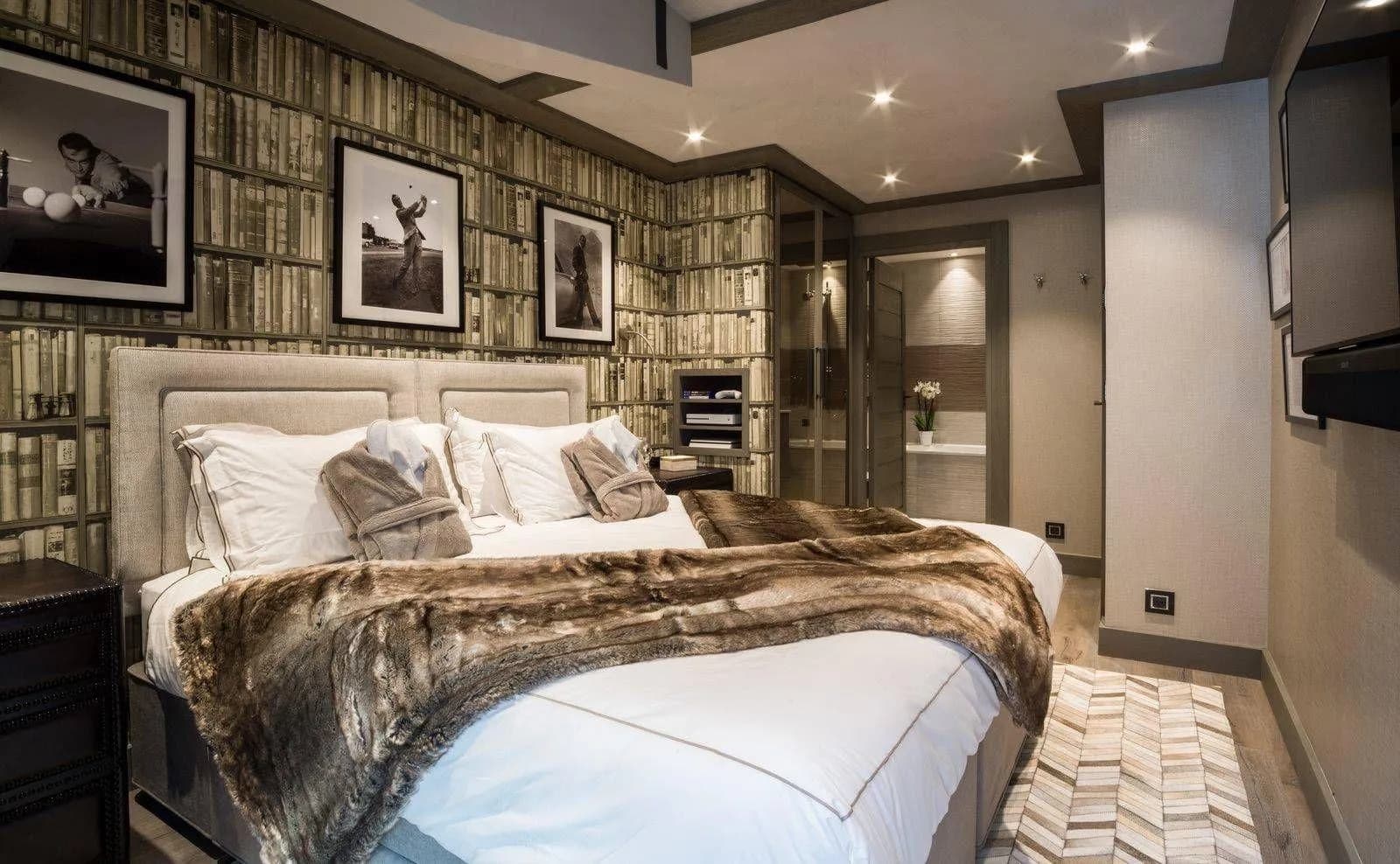 Double bedroom with an upholstered headboard and en-suite access