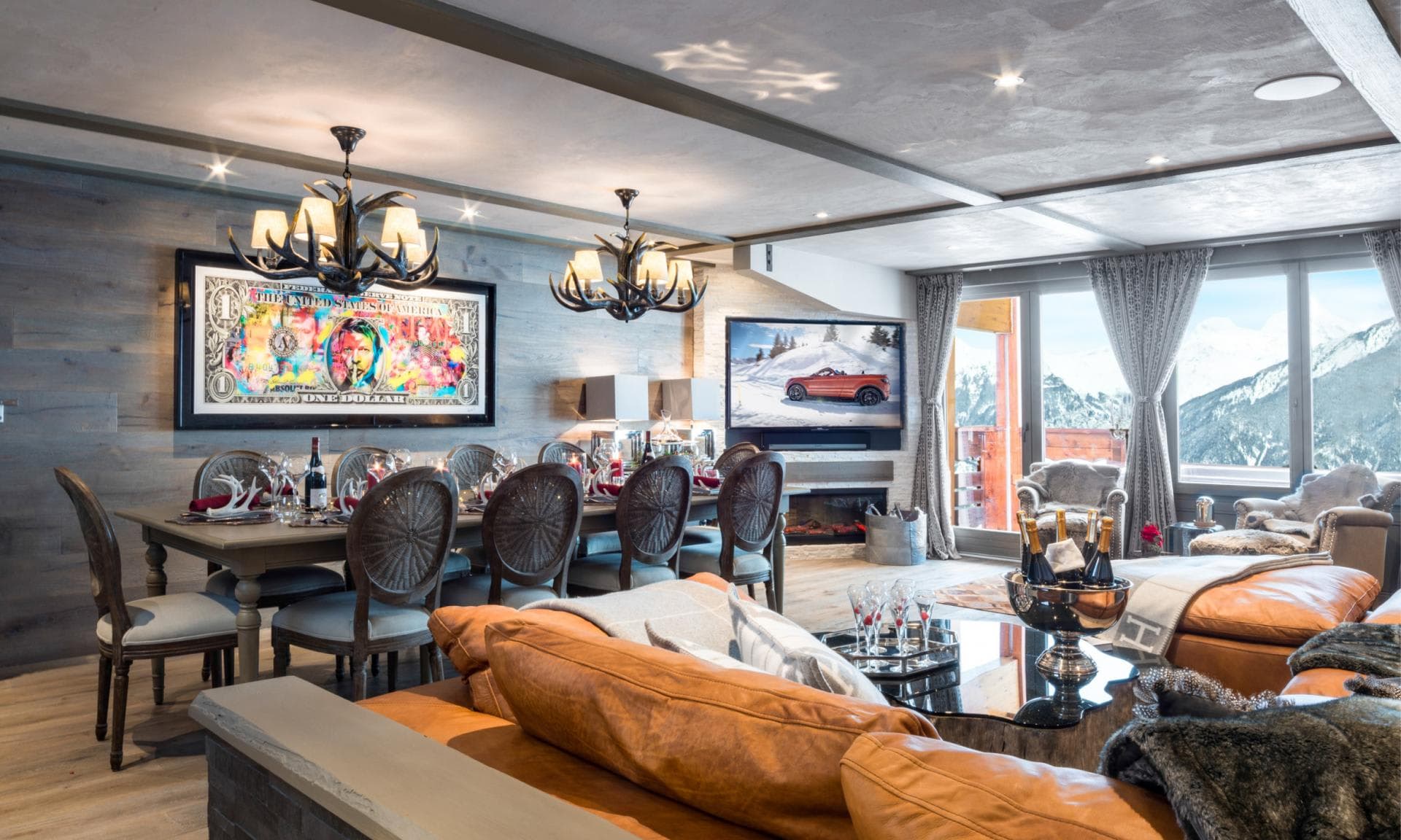 Open-plan living area with 10-person dining table and mountain views